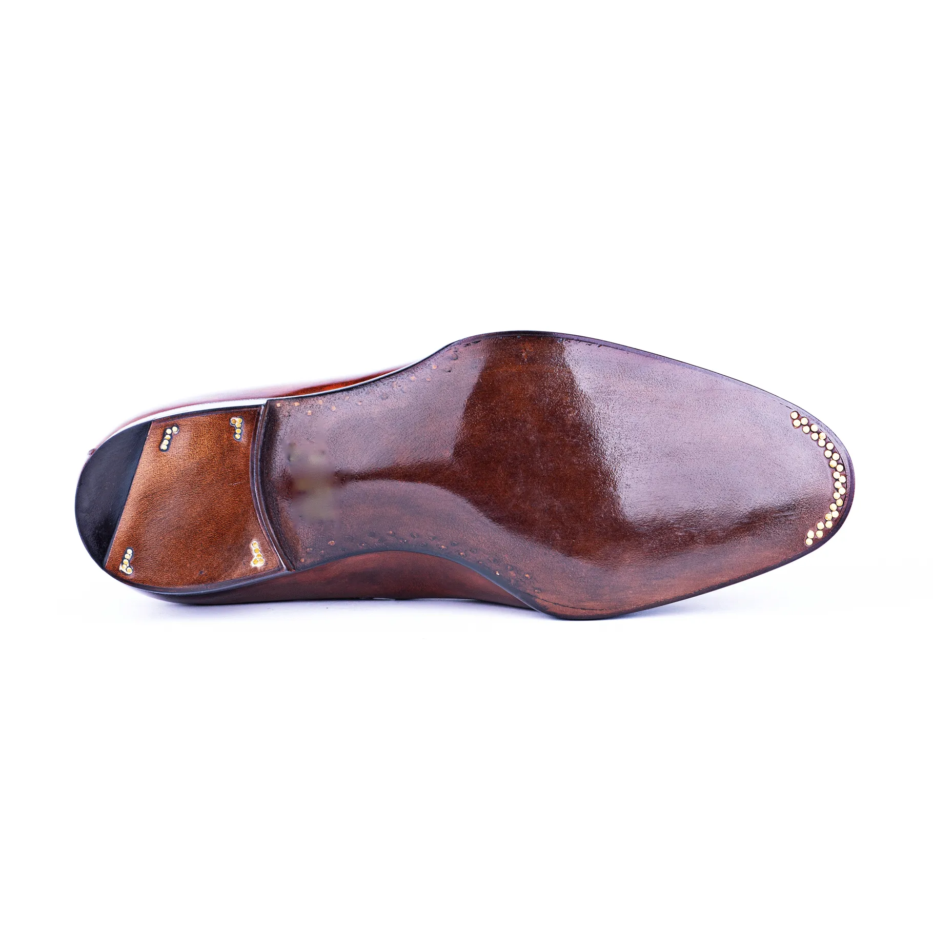 Loafer with hand stitched apron and tassels, no split toe