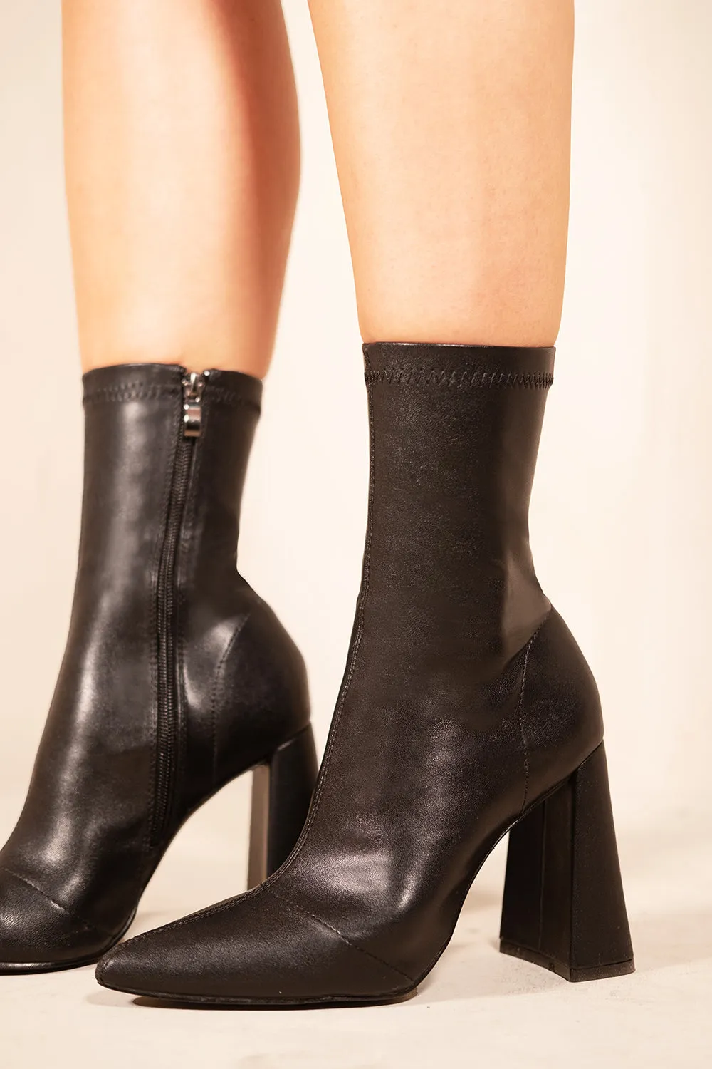 QADIRA BLOCK HEEL ANKLE HIGH BOOTS WITH POINTED TOE & SIDE ZIP IN BLACK FAUX LEATHER