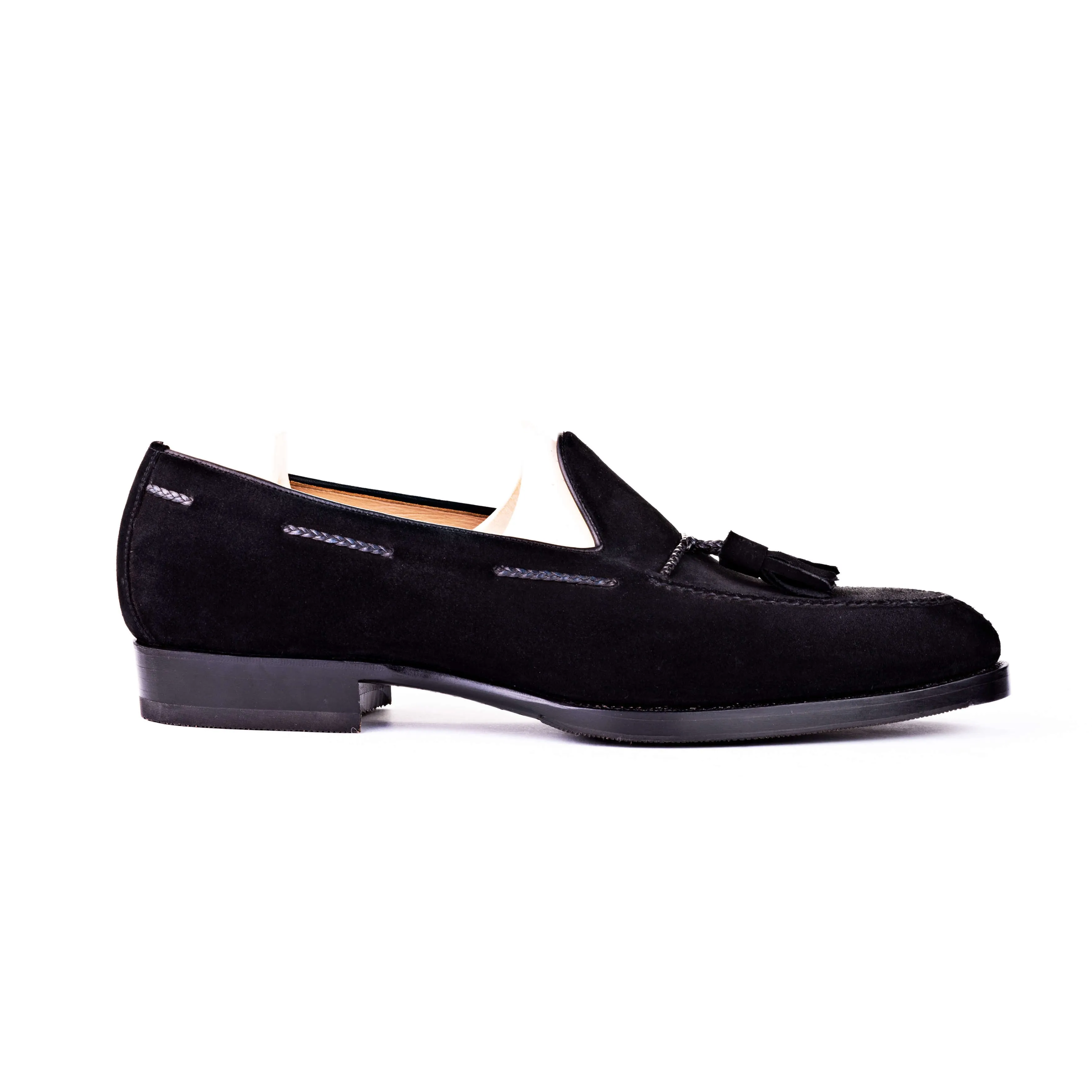 Tassel loafer with hand stitched apron in black suede