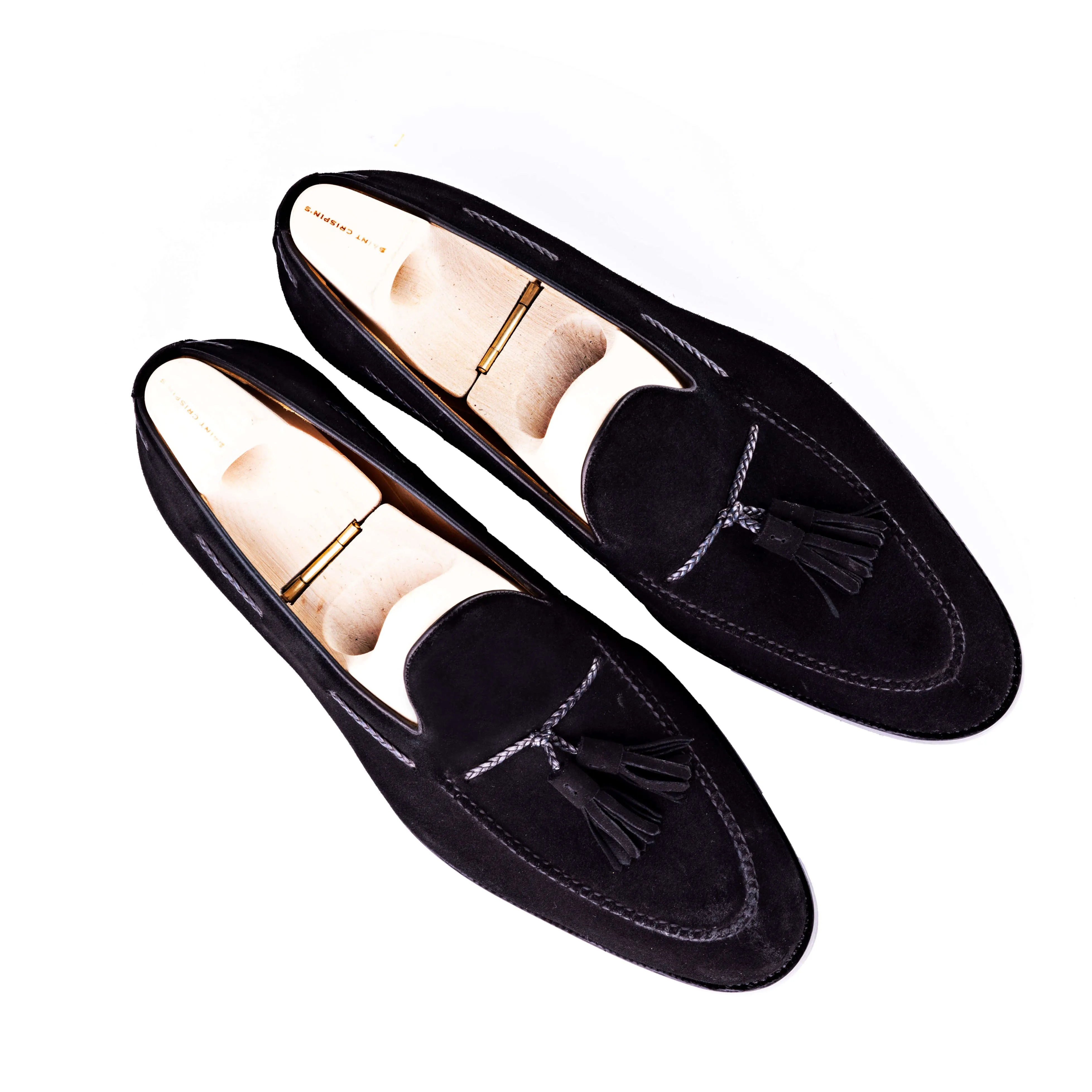 Tassel loafer with hand stitched apron in black suede